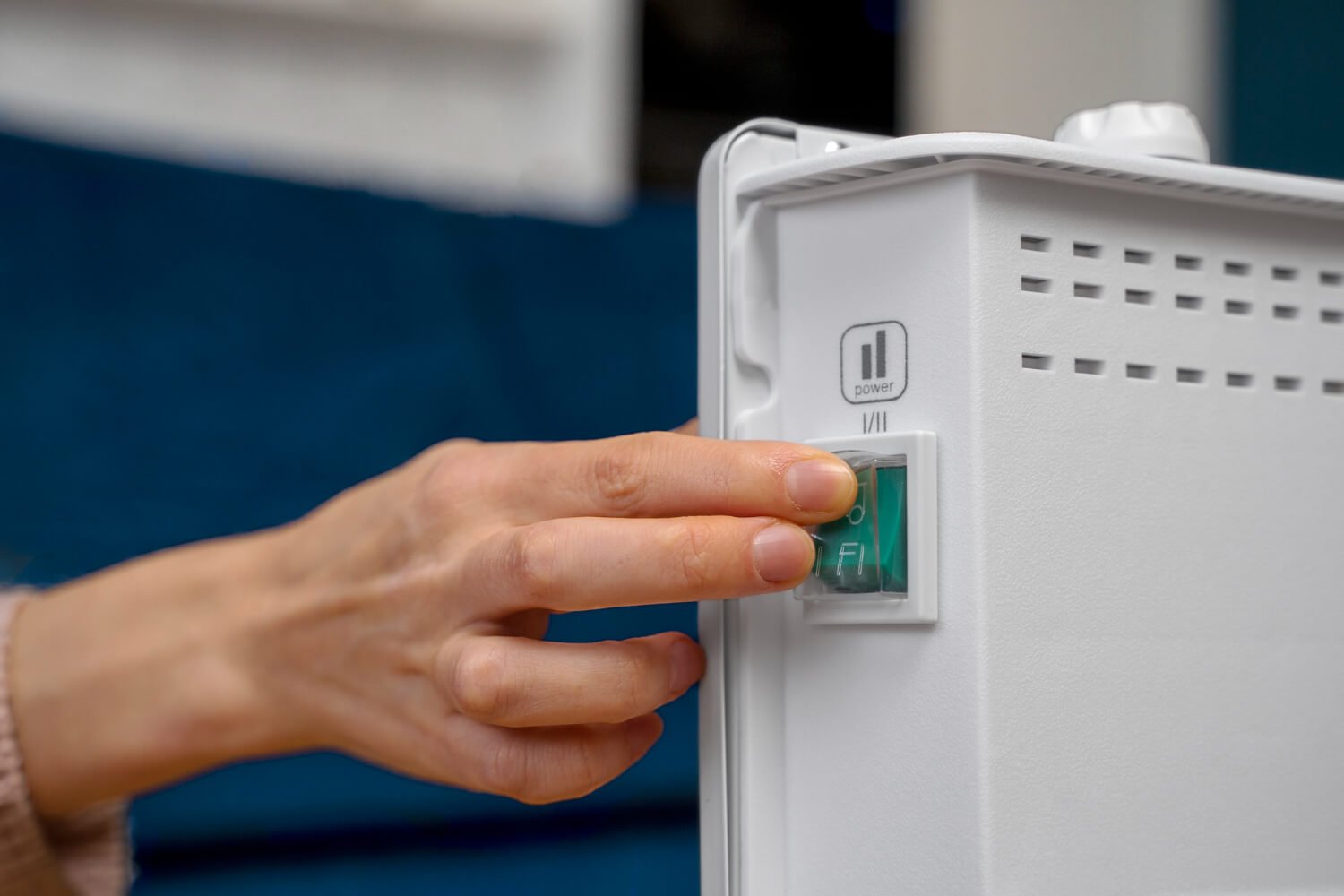close-up-hand-pressing-heater-button (1)